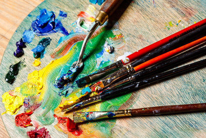 close up oil paints brushes palette site