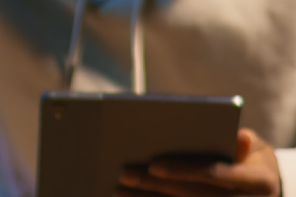 african american person using his tablet laying couch72172