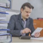 young businessman working from his office 1